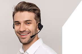 Smiling young man wearing a headset with microphone against a neutral background.