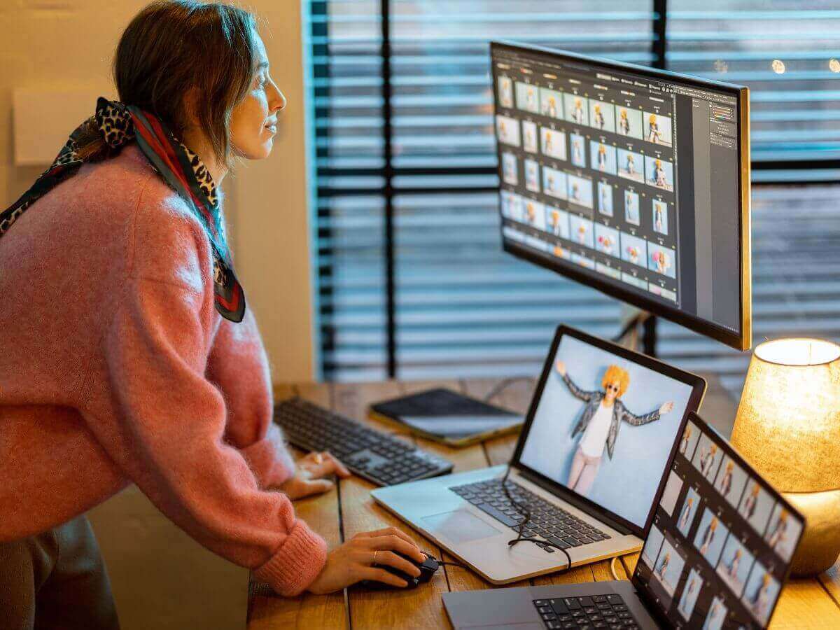 Photo of a woman editing several digital photos