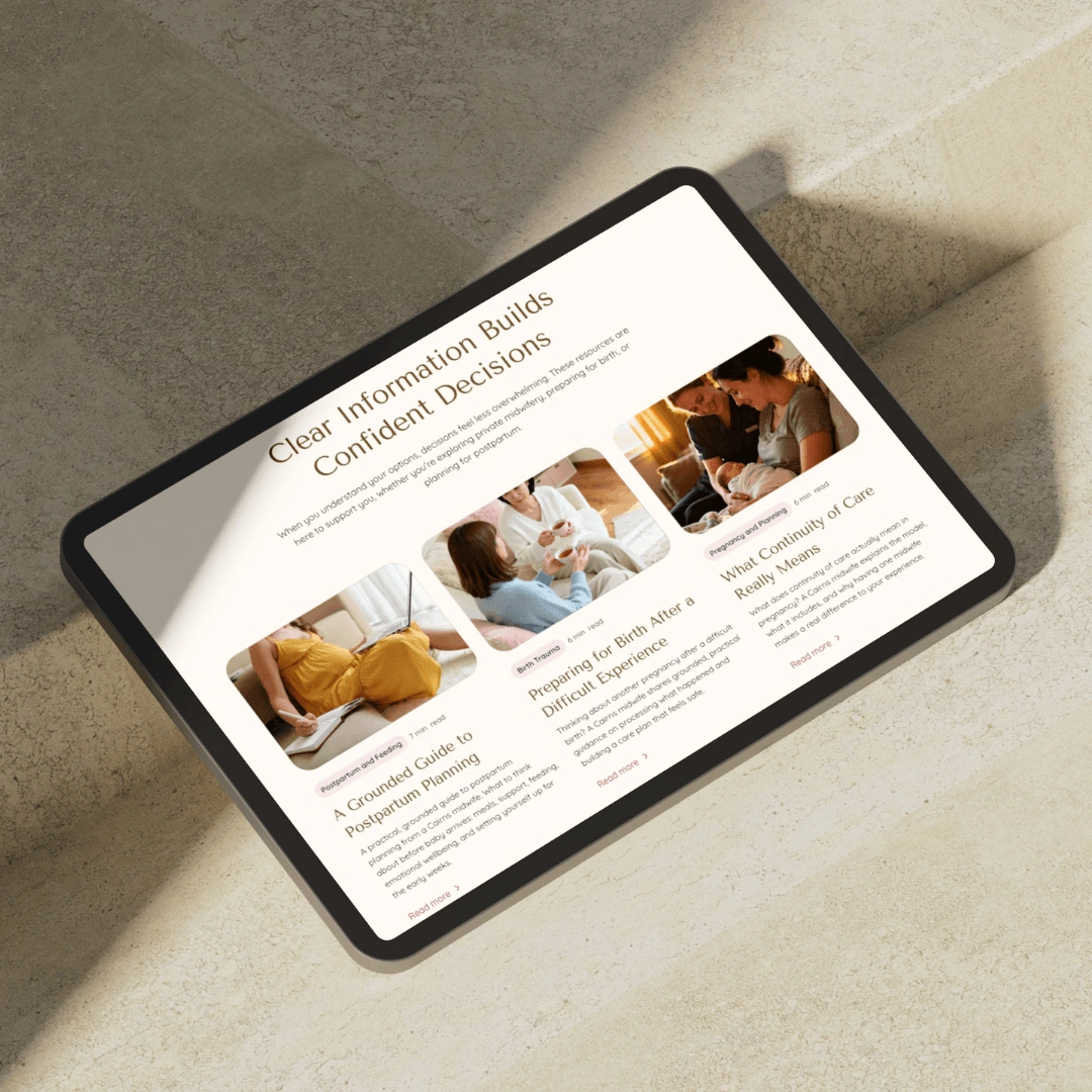 Tablet mockup on a sunlit concrete step displaying the "Clear Information Builds Confident Decisions" resources page on the Beneath the Palms Midwifery website