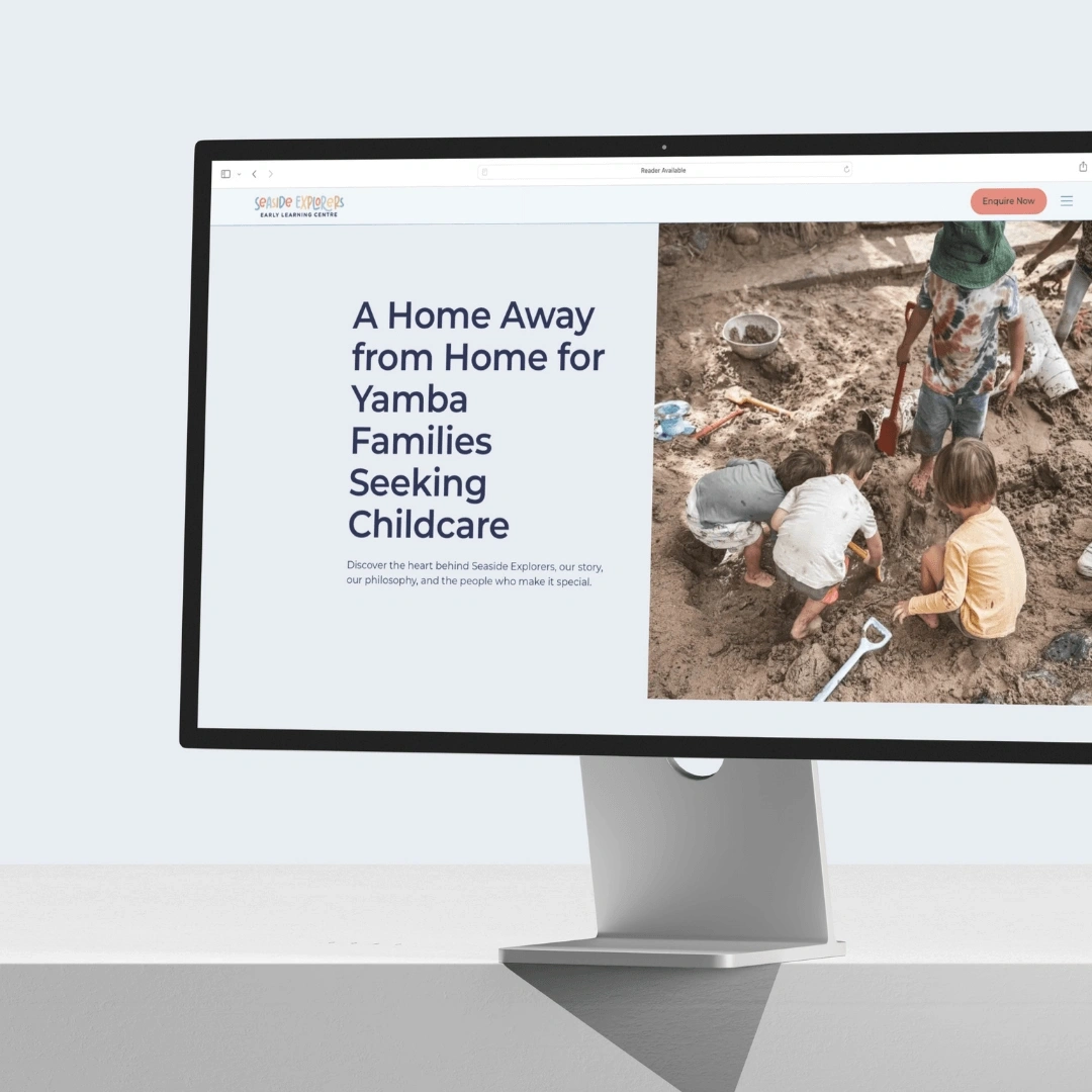 Desktop monitor mockup displaying the About page hero on the Seaside Explorers website, reading "A Home Away from Home for Yamba Families Seeking Childcare"