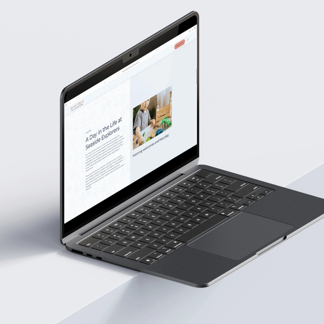 Laptop mockup displaying the "A Day in the Life at Seaside Explorers" page on the Seaside Explorers Early Learning Centre website
