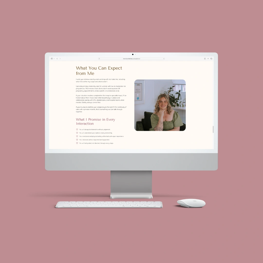 Desktop monitor mockup against a pink background, displaying the "What You Can Expect from Me" page on the Beneath the Palms Midwifery website