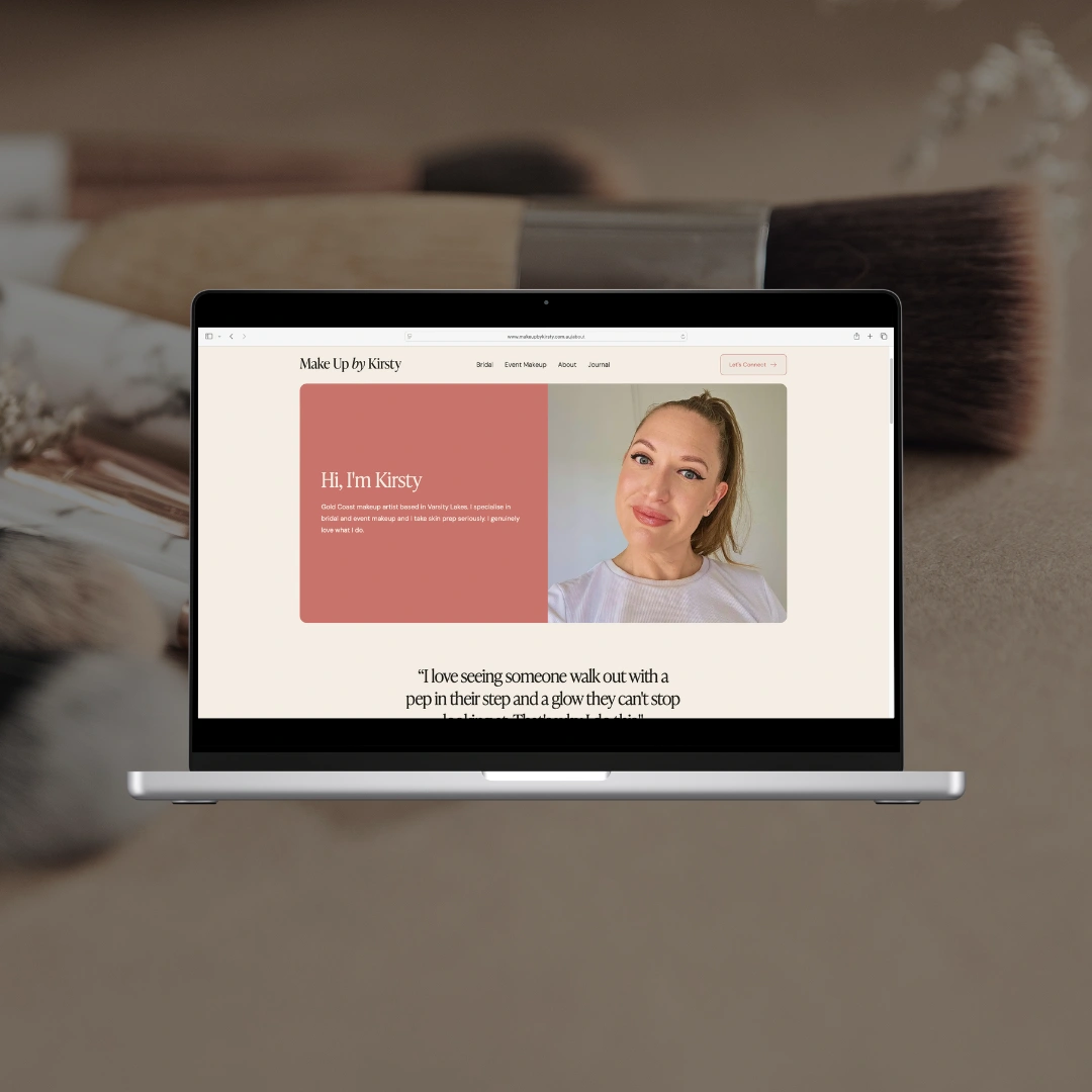 Laptop mockup on a makeup brush background displaying the "Hi, I'm Kirsty" About section and a client testimonial on the Make Up by Kirsty website