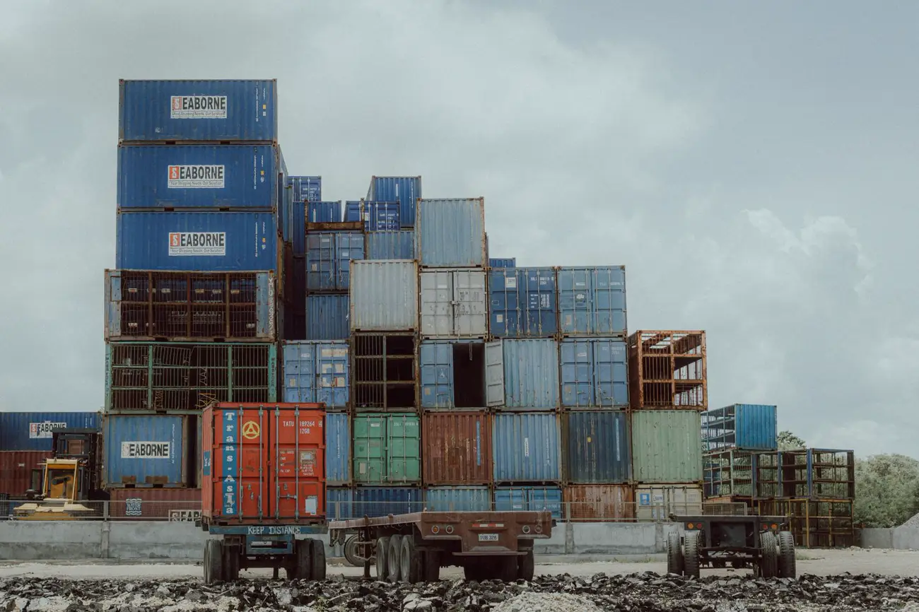 Containers and a truck at a logistics yard