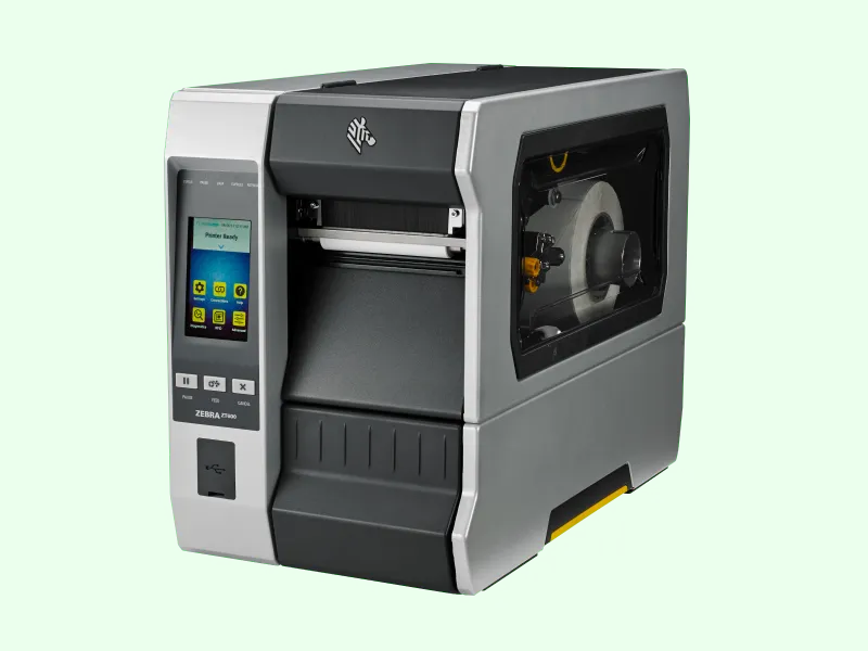 Zebra industrial thermal label printer, three-quarter view on pale green