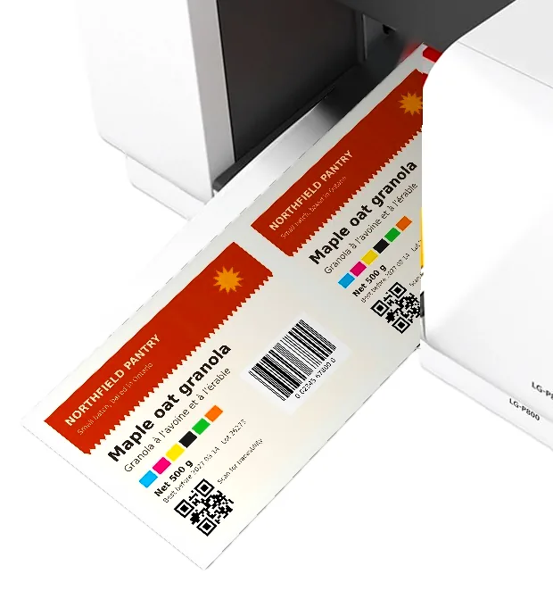 Close view of cut colour label sheets leaving the front of the Canon LG-P800.