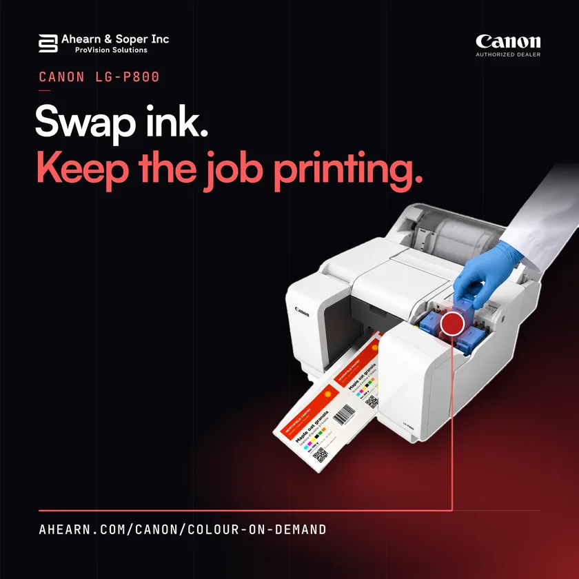 A gloved hand replaces an ink tank on a white Canon LG-P800 while colour labels keep printing. Text: Swap ink. Keep the job printing.