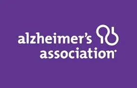 Alzheimer’s Association logo with white text and symbol on a purple background.