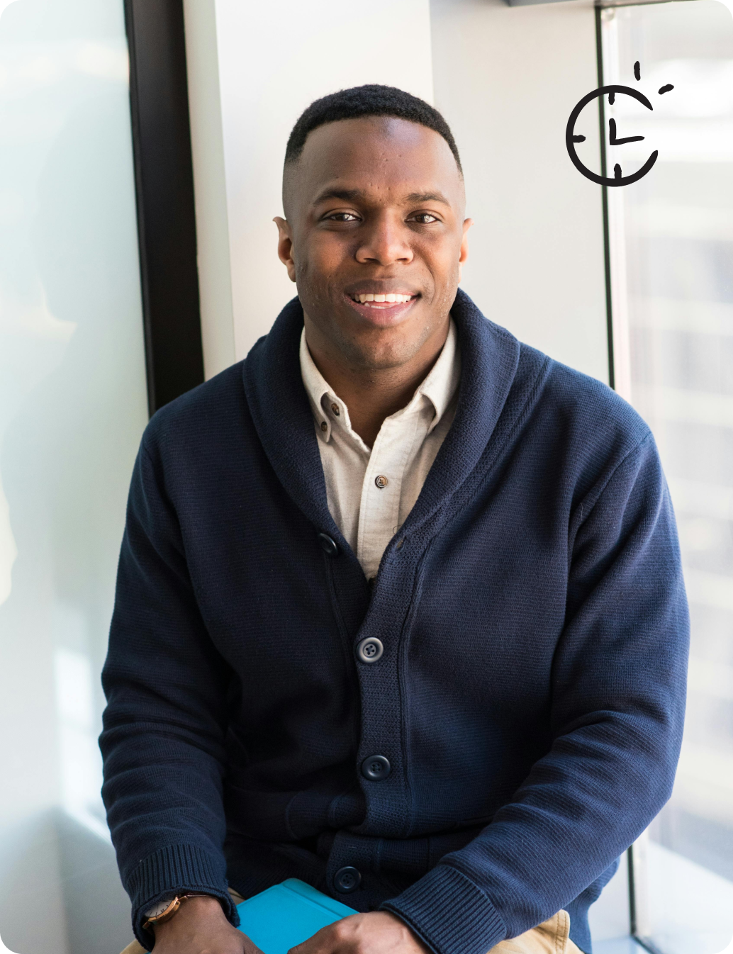 Man laughing with clock

