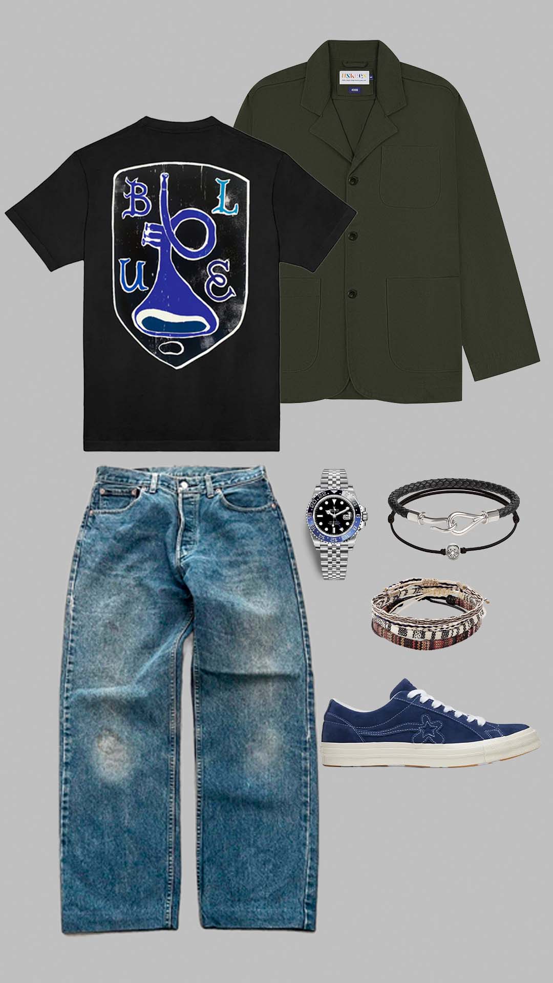 baggy casual outfit for men with relaxed denim jeans graphic tee and green blazer