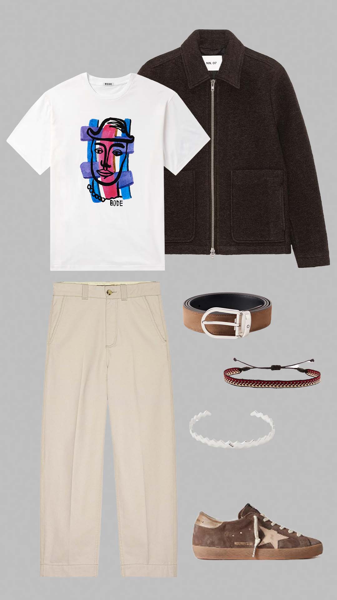 Old money outfit for men with white graphic t-shirt, brown zip jacket, cream trousers and brown suede golden goose sneakers