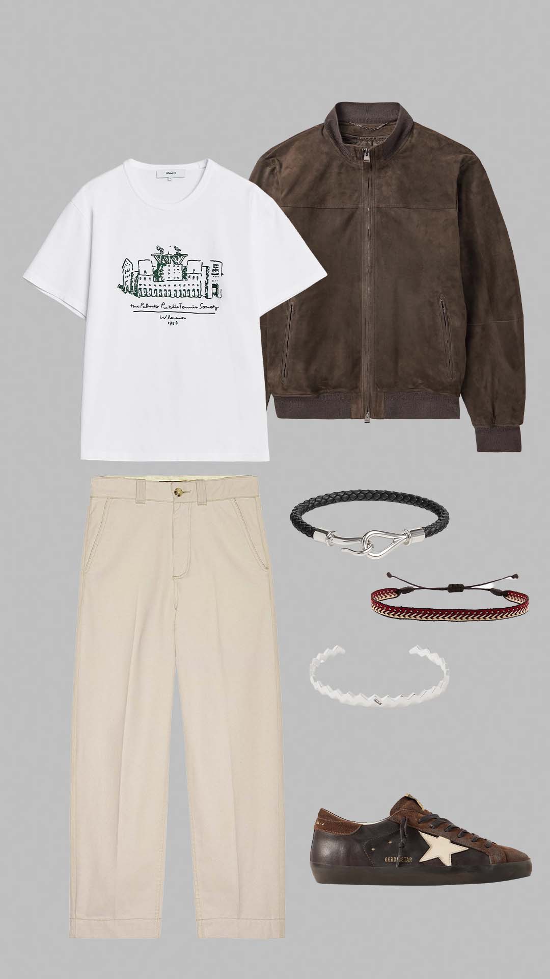 Old money outfit for men with white graphic t-shirt, brown suede bomber jacket, cream trousers and brown sneakers