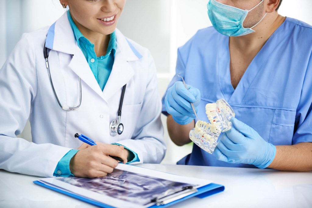 Doctors meeting in clinic for same day dental implants in orlando