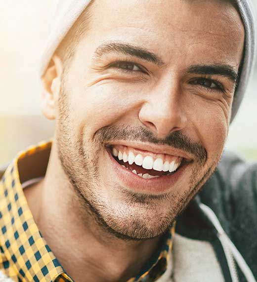 WHAT ARE THE HEALTH BENEFITS OF A BEAUTIFUL SMILE?