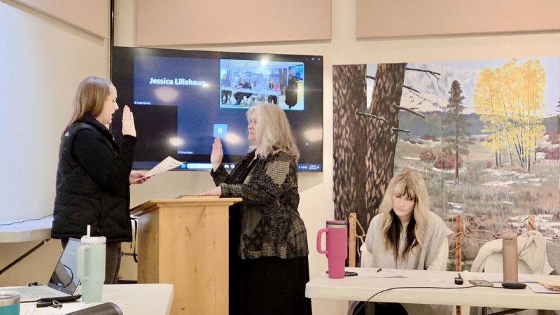 Kyla Gardner New Meadows city clerk, left, swears in Julie Good to her new term as Mayor of New Meadows. Photo credit: Rachel Reynaga.