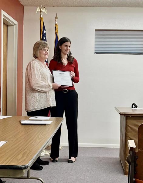 Taylor Powell, right, after being sworn in to the Cambridge city council by Sandra McKee, City Clerk. Photo credit: Deana McConnell.