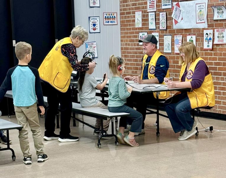 Lions members conducting hearing screenings. Photo credit: Midvale Lions