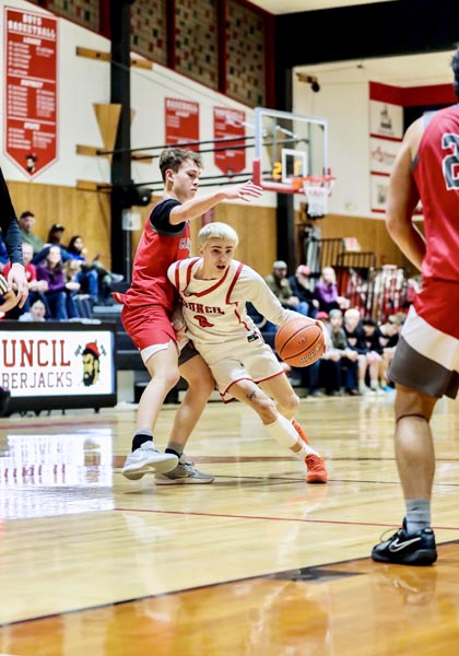 Senior Garrison Zielinski gets around a Clearwater Valley defender during Council’s game at home against Clearwater Valley on the 4th. Council won 64-24.	Photo credit: Patty Guilford, Gameframephoto.com