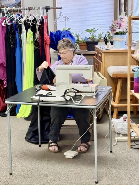 Virginia Vieira volunteered to do alterations on dresses for recipients.