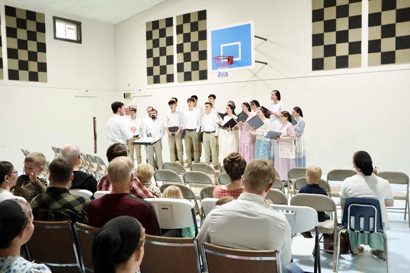 Clayton Schrock leads the Council Valley Mennonite Choir last Friday evening at the Council Valley Mennonite Church. The Record Reporter