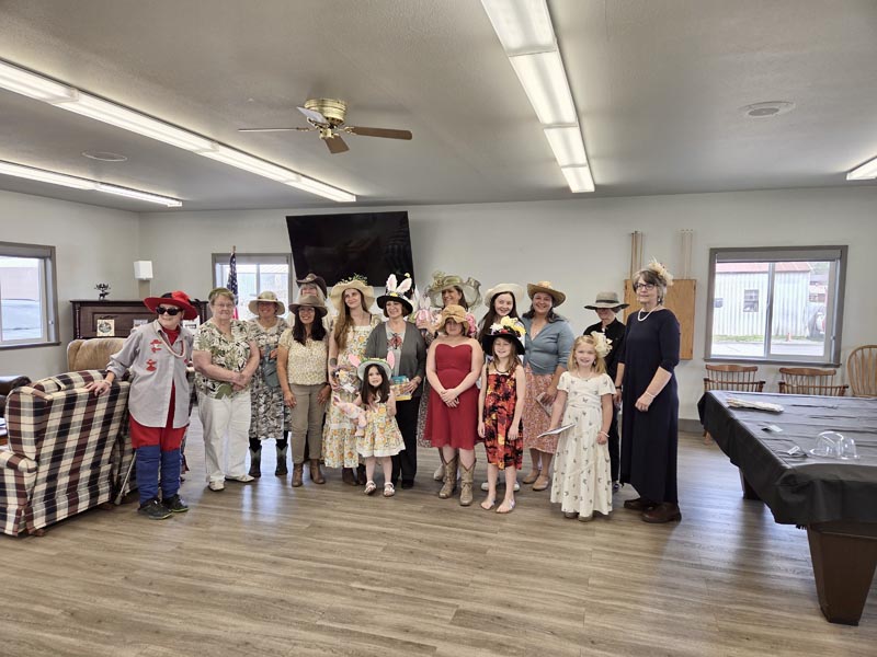 Attendees at the Meadows Valley Community Center’s Tea Party and Spring Hat Contest pose for a picture.Photo credit: Renee Novo.
