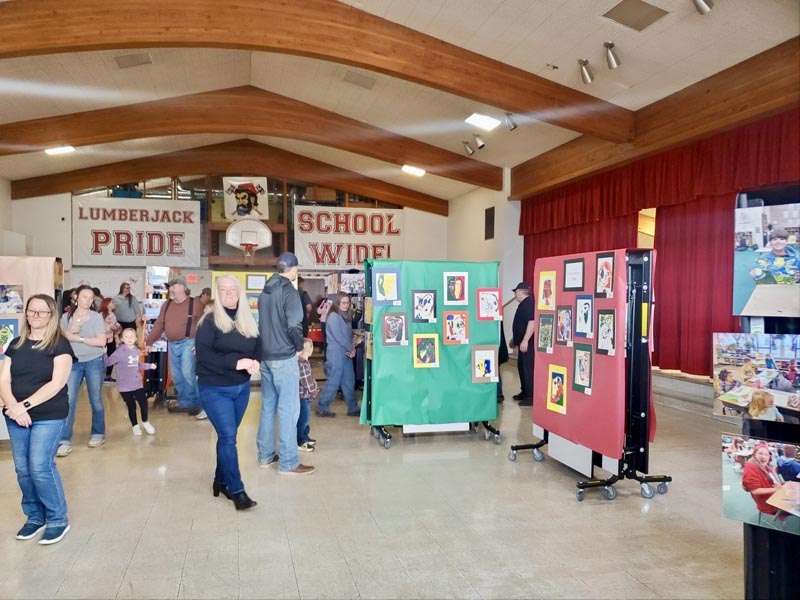 Guests and parents enjoy the art on display from Elementary students.Photo credit: Camille Collings.