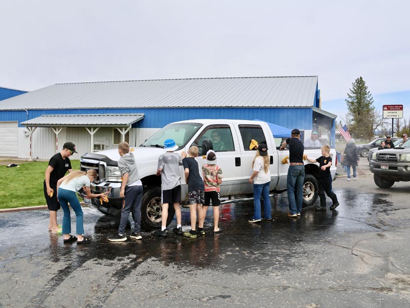 Local youth wash vehicles on April 18 in front of Jerry’s Auto in Napa.Photo credit: The Record Reporter.