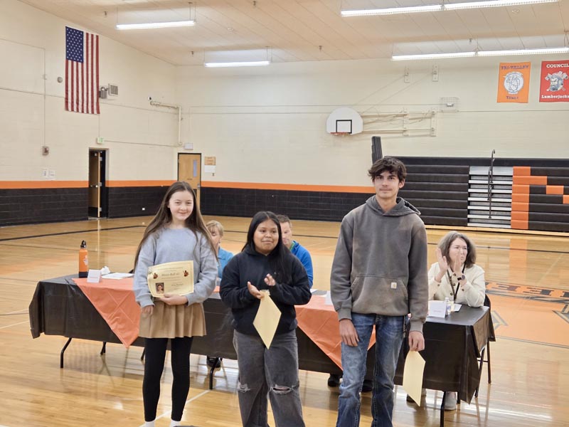 L-R: Mary Reynaga, Jannette Montemira-Flores and Jake Hendrix receive awards recognizing their academic work and progress.Photo credit: Rachel Reynaga.