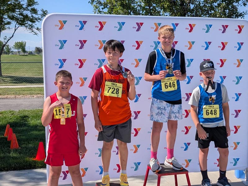 Boaz Reynaga (#728) on the podium at the YMCA Middle School State Track meet. Boaz placed 2nd in the High Jump, 4th in the Triple Jump, 6th in the Long Jump and 8th in the 200M.Photo credit: Jeremy Reynaga.