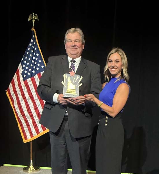 Mayor Loveland accepts an award for the City of Cambridge from Blue Cross of Idaho for Cambridge being a ‘Community Health Champion.’