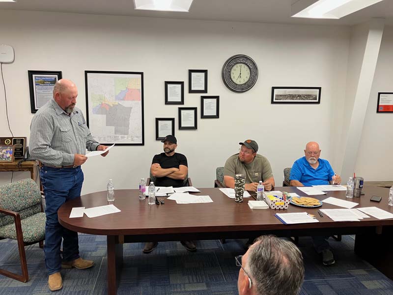 John Whitener was sworn in as Midvale School Trustee Monday evening. Observing are Daniel Leuthold, Jake Mikek, Jerry Piper, and not pictured Jerry Lunsford at far right. Photo credit: Bonnie Evans.