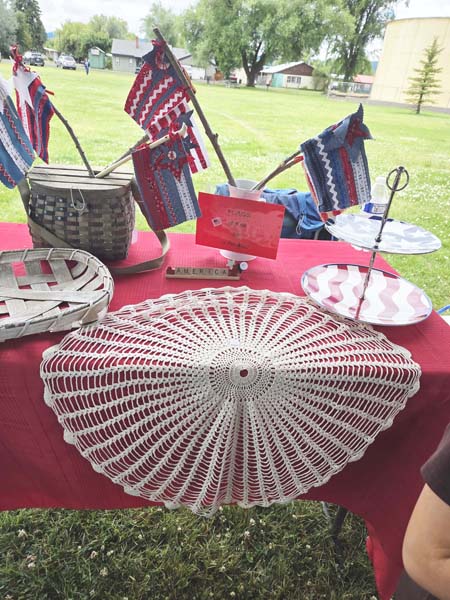 One of the booths at the New Meadows Farmers Market selling patriotic decorations.Photo credit: Rachel Reynaga.