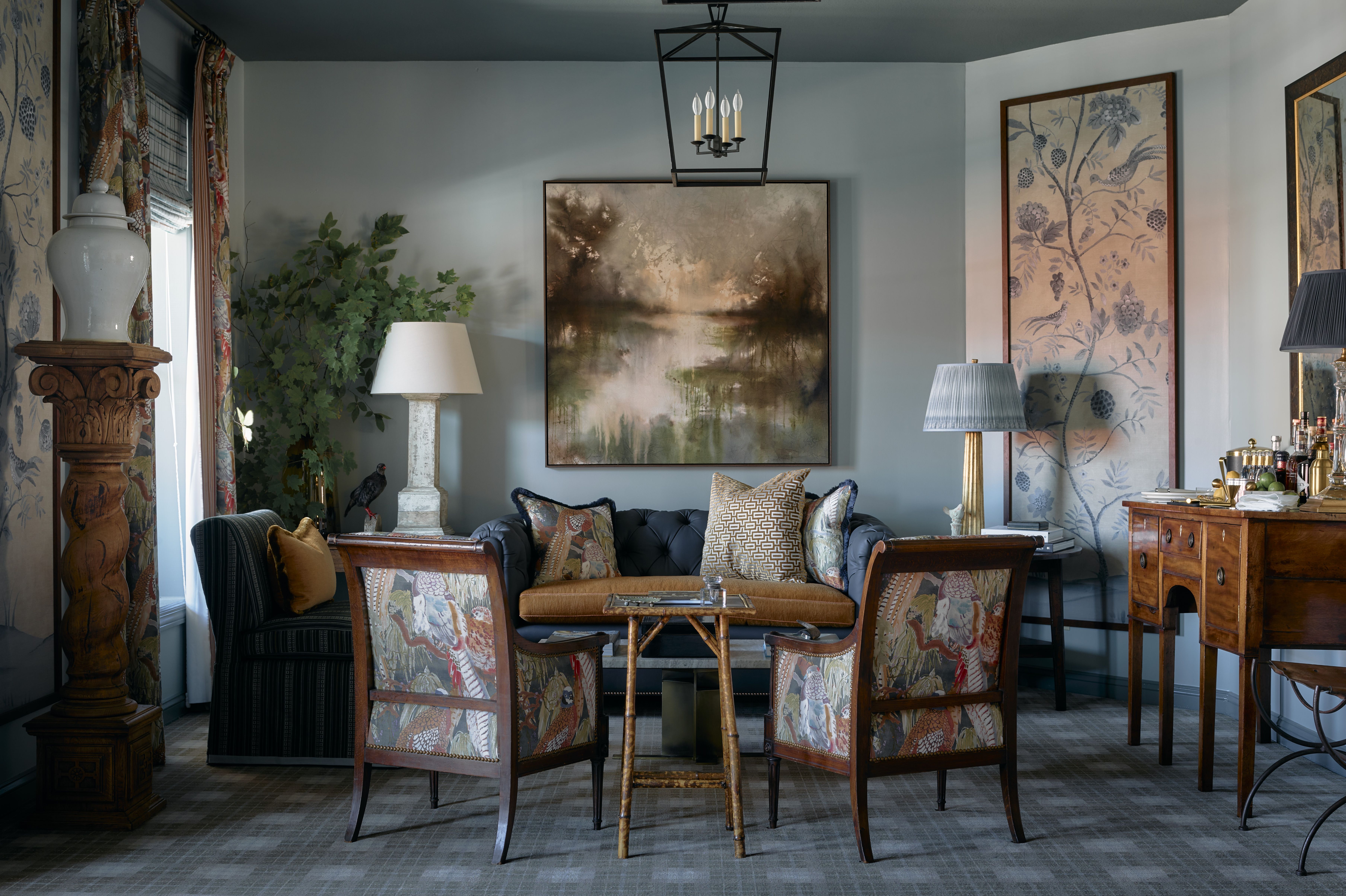 Group of people seated at wooden tables in a cozy restaurant with exposed brick walls, with a waitress taking an order.