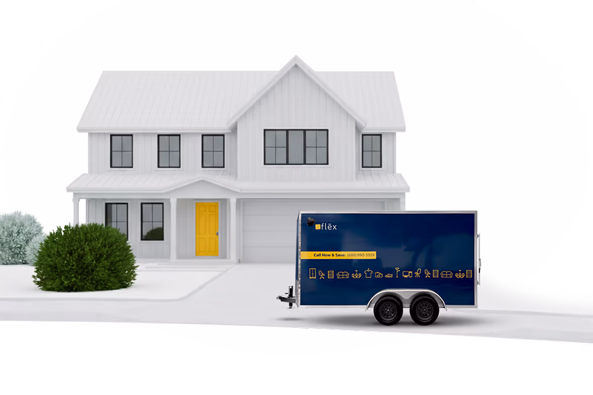 Navy & yellow Flex branded enclosed trailer parked in front of a modern white two-story house with yellow door and green bushes