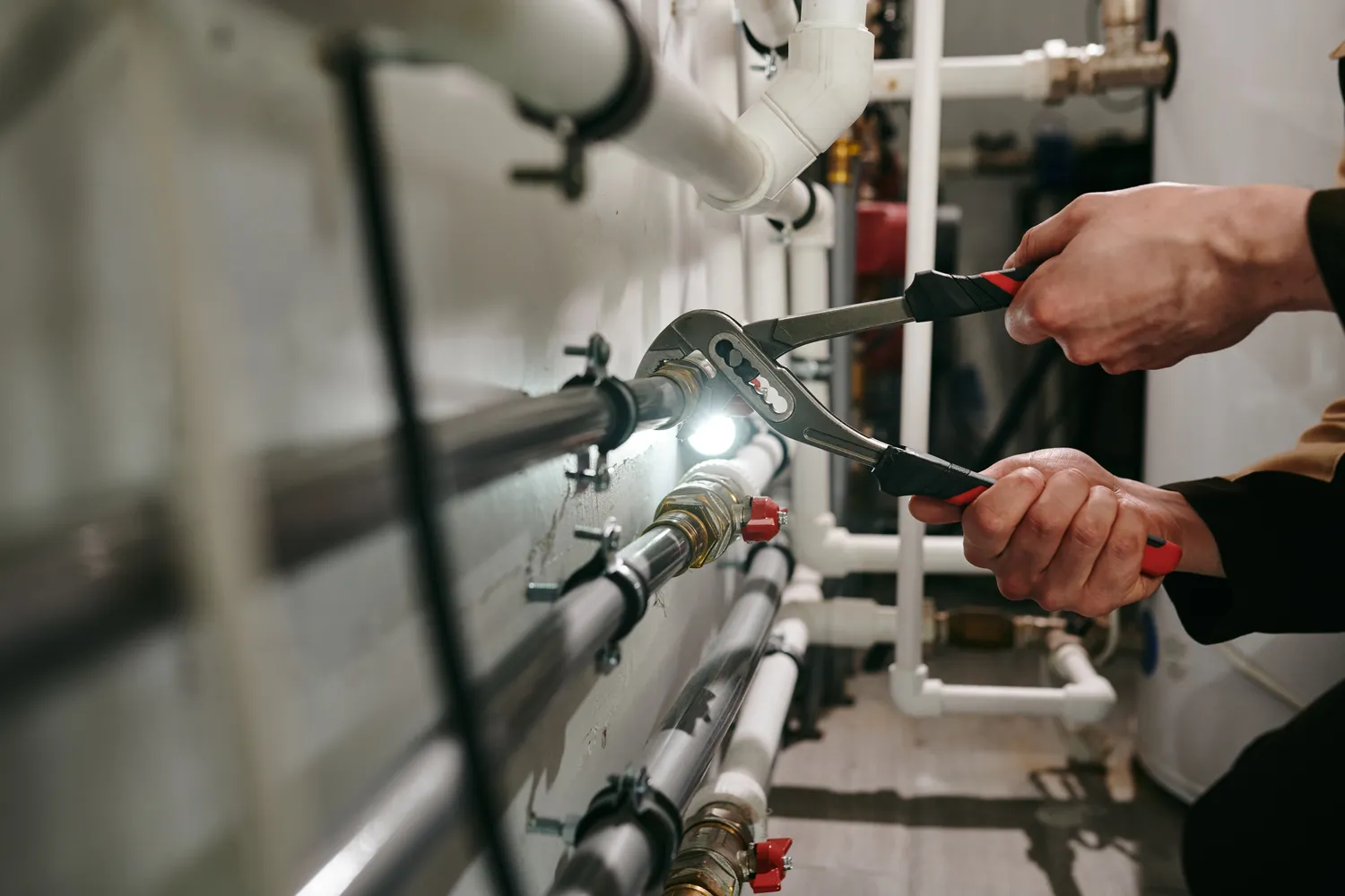 a person working on a pipe