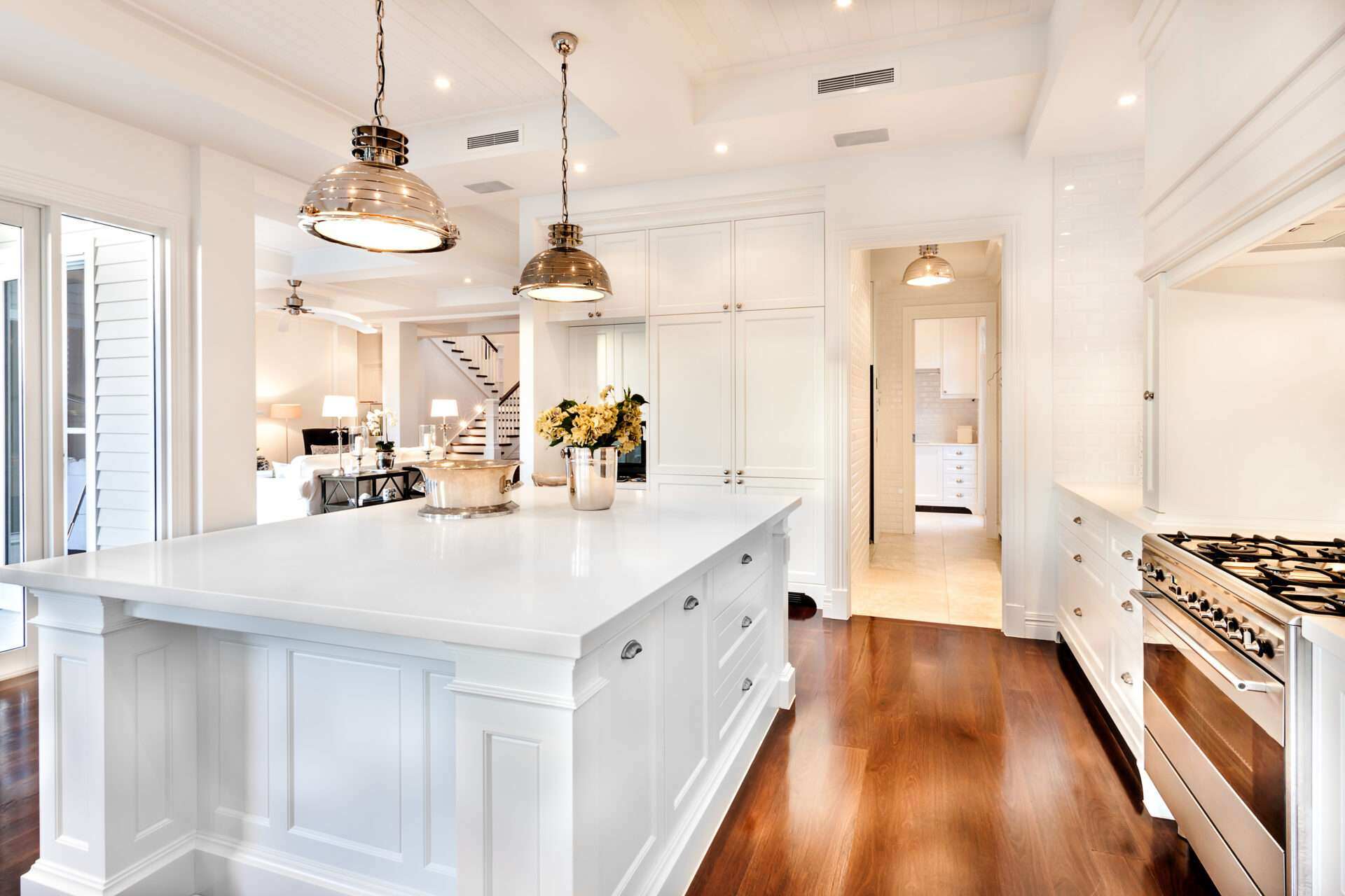 Remodeled kitchen with layered pendant and recessed lighting