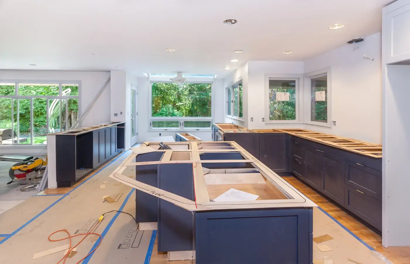 Kitchen mid-remodel with cabinets removed and new work underway