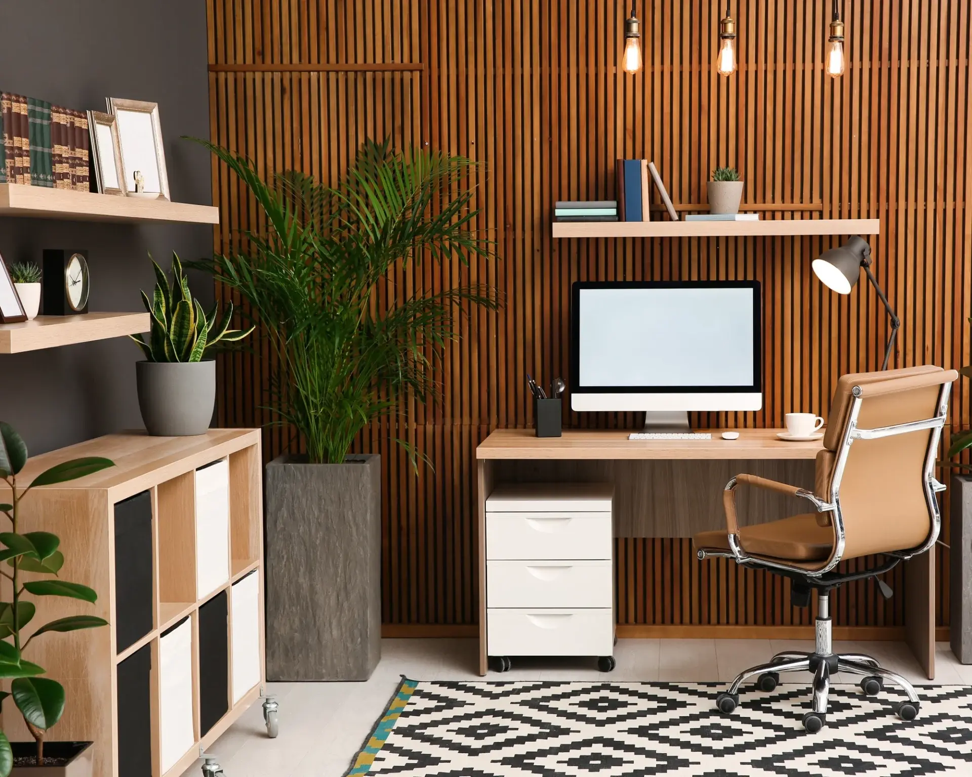 Compact home office built into a finished basement corner