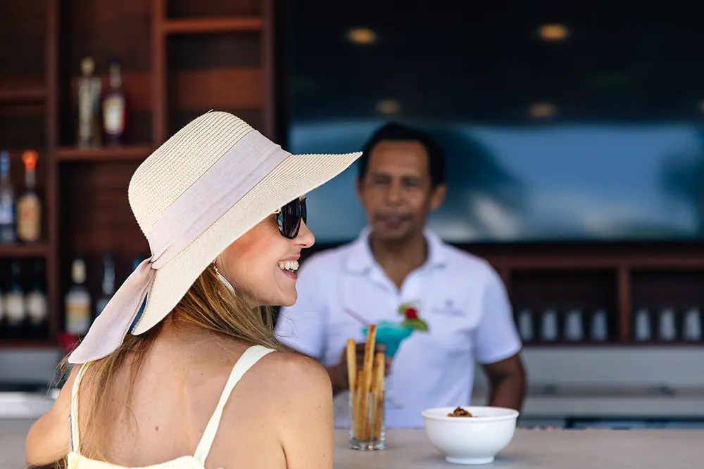 Close-up of underwater marine biologists performing delicate coral reef maintenance in the TCI.