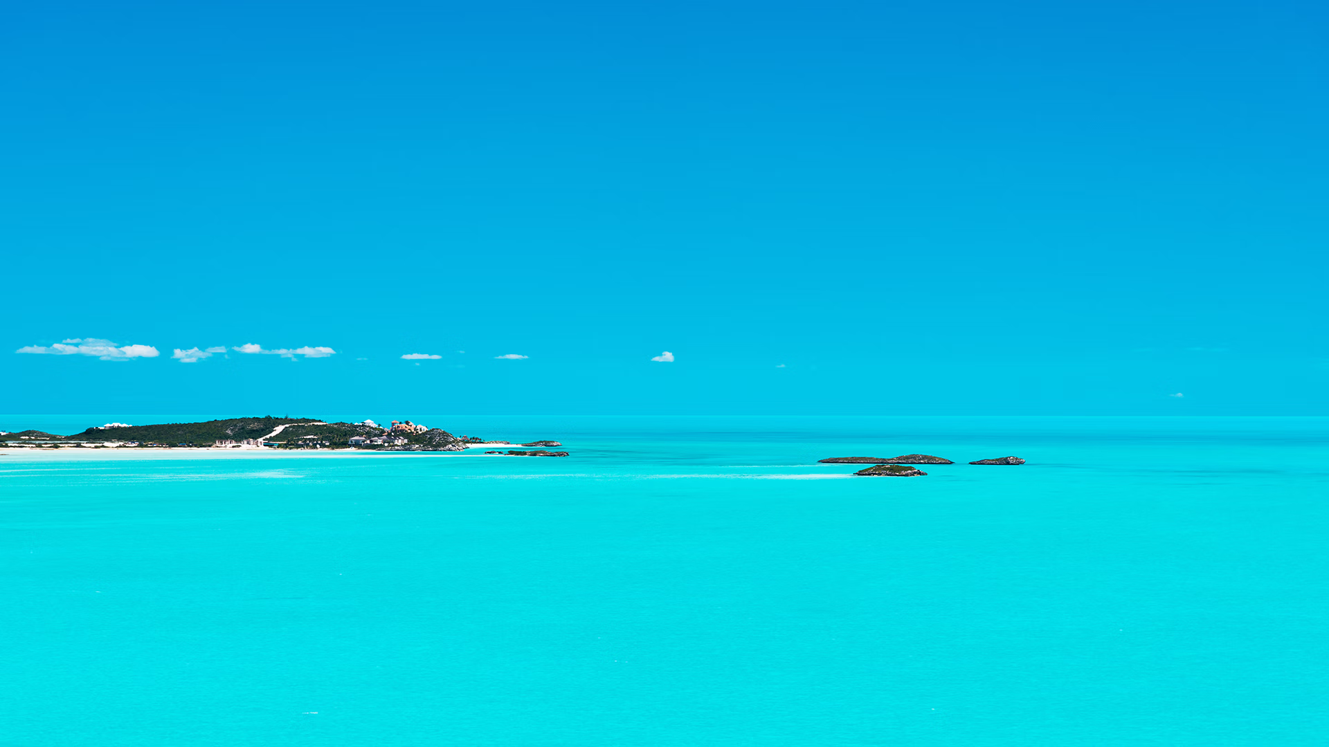 Island House LVM team members participating in a community beach cleanup in Turks and Caicos.