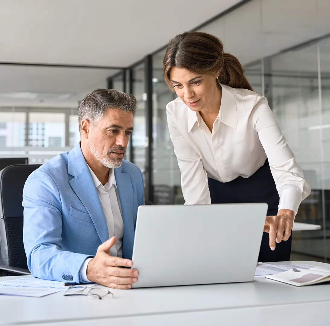 Two people looking at a computer screen