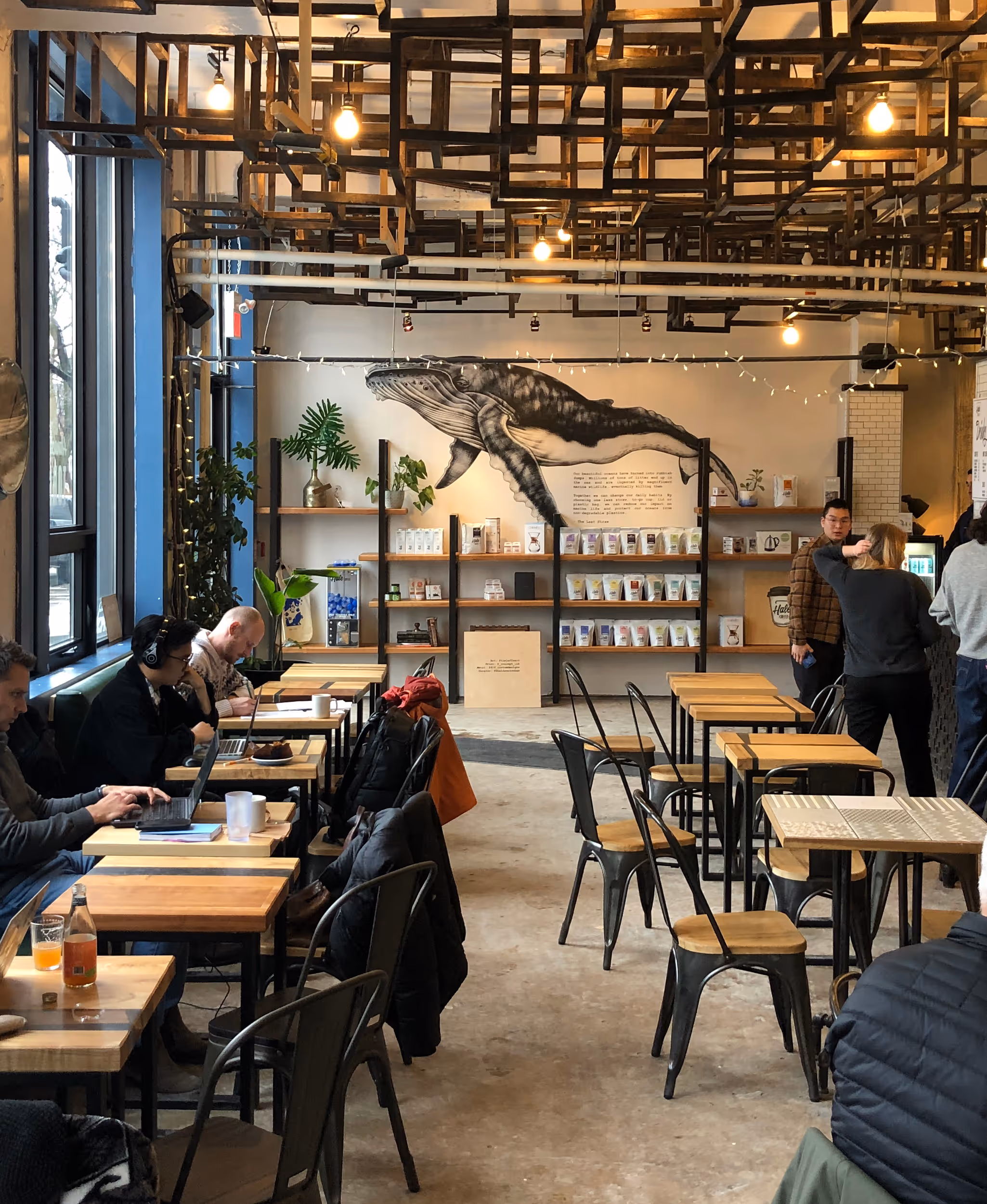 A wall print of a whale in a coffee shop