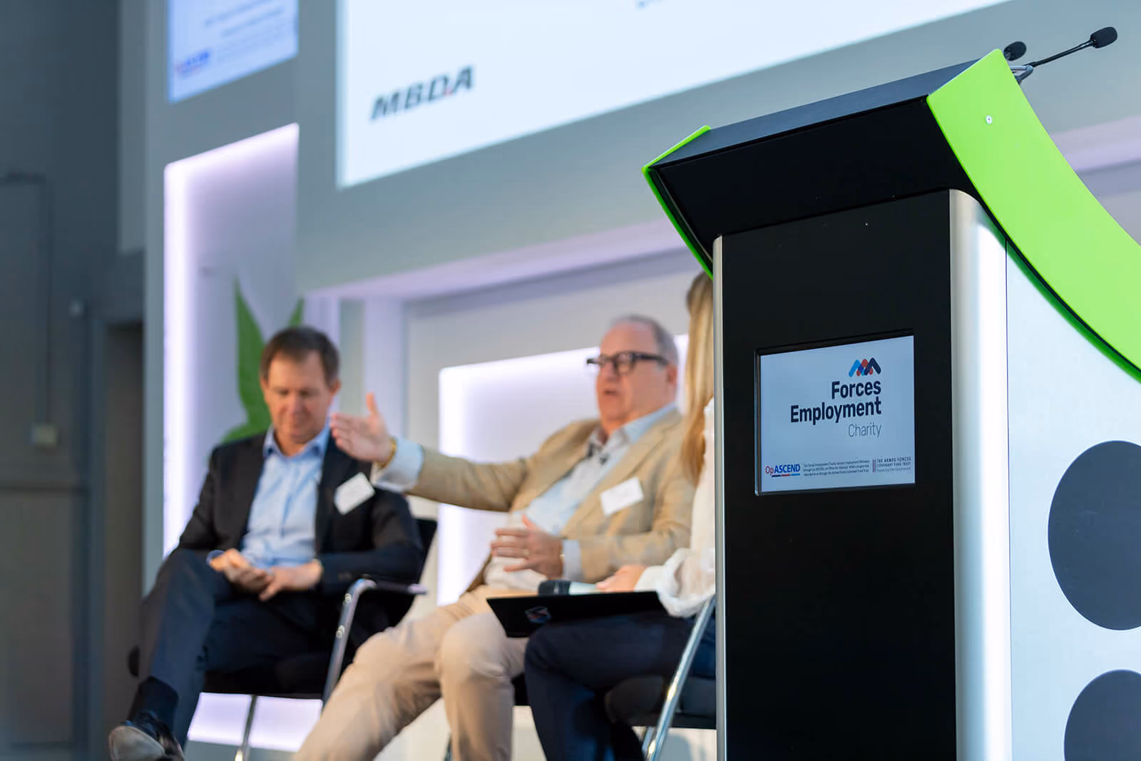 Panel discussion beside the Forces Employment Charity lectern — event photography by AlTopping.com