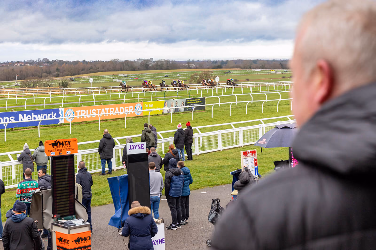Horses racing in full flight seen over spectators at Carlisle Racecourse — by AlTopping.com