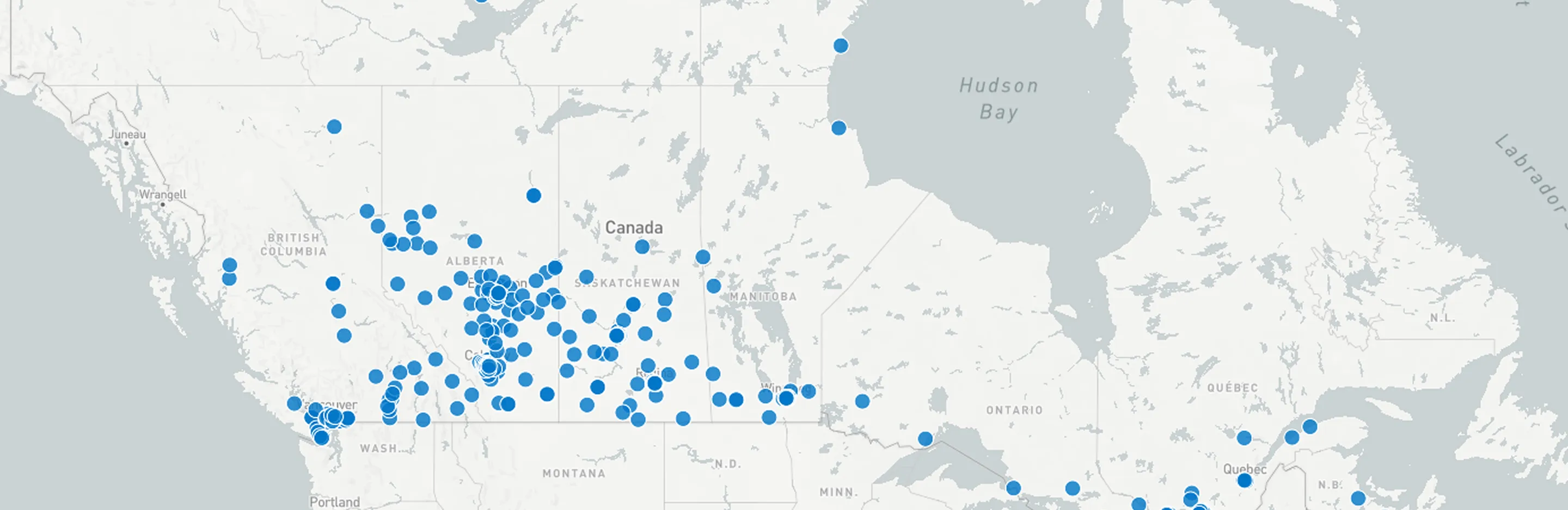 Map of Canada showing multiple blue dots scattered across provinces indicating locations.