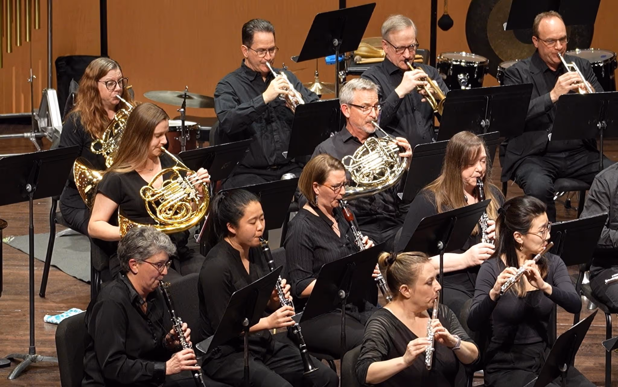 Megan playing horn in a concert band