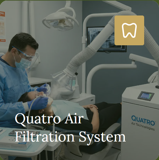 A Quatro air-filtration unit positioned beside a clinician during dental care.