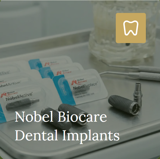 Nobel Biocare implant components and packaging on a dental work surface.