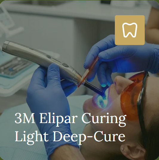 A 3M Elipar curing light used during a dental procedure.