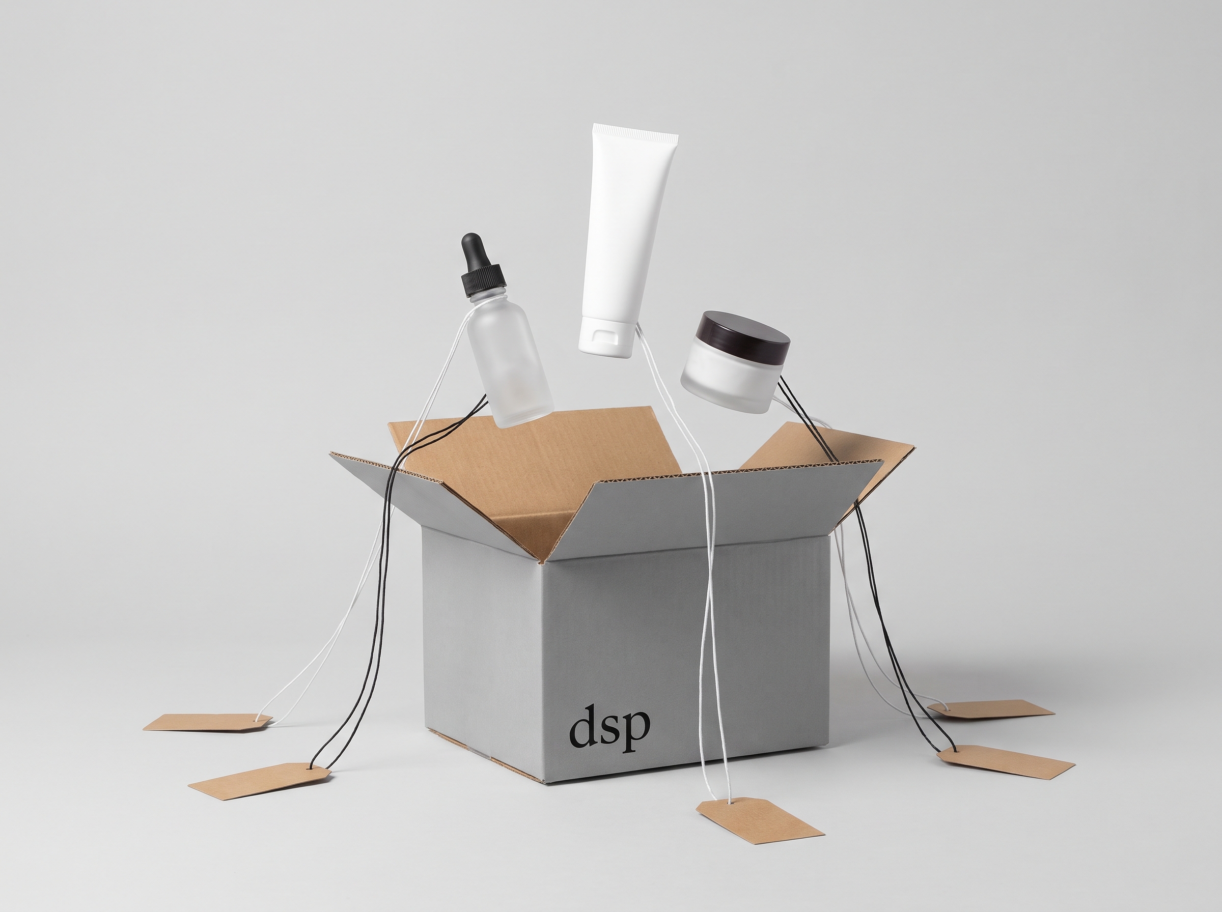 Open grey shipping box labeled dsp with Korean skincare products tied to audience tags